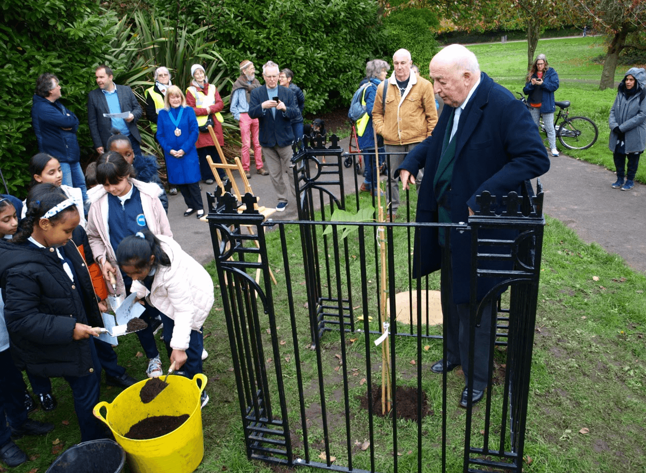 The Duke of Devonshire planting the Chinese Tulip tree with schoolchildren in Princes Park, Liverpool 