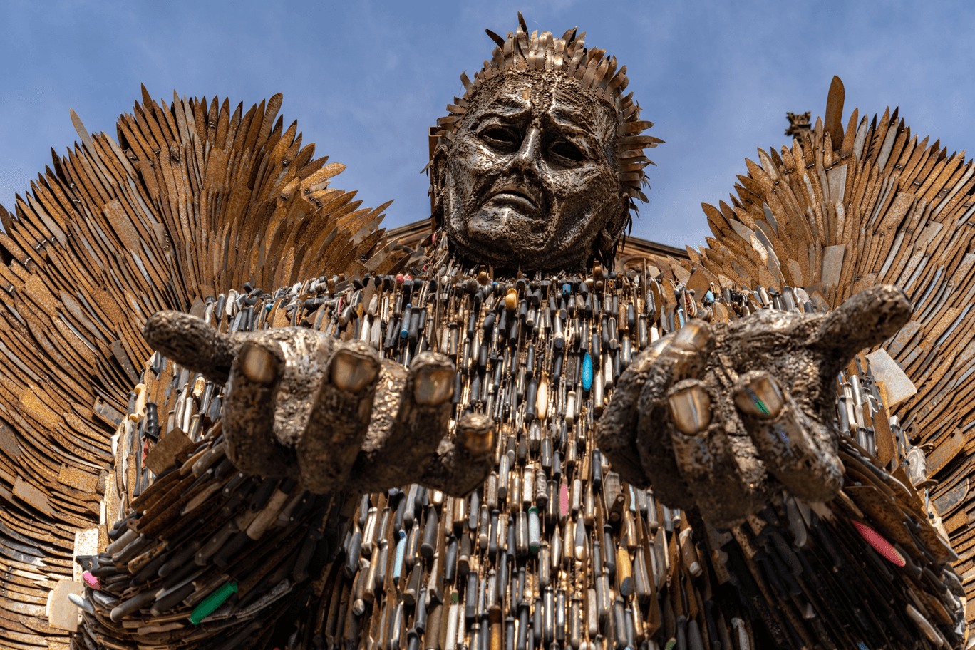 A sculpture representing an angel made of knives