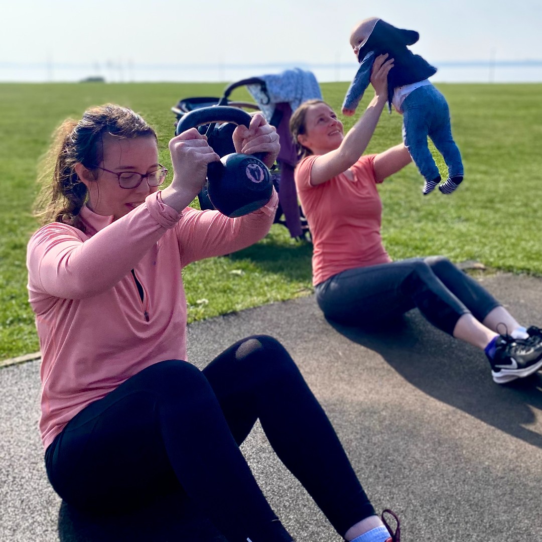 mother participating in mamafit kettlebells
